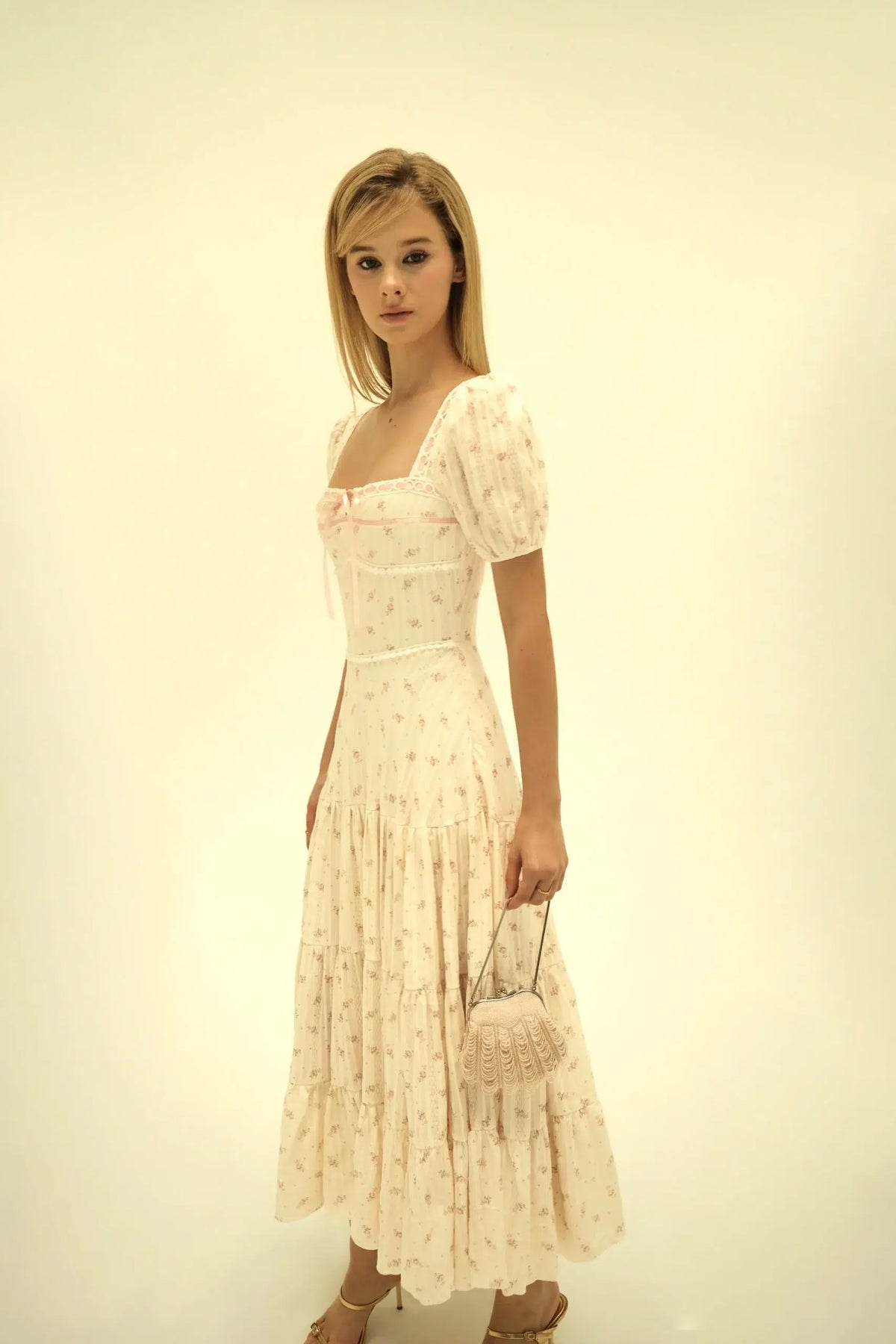 Lucille Dress Pink Rose by Tiffany Studio — cream floral, full length with a bag